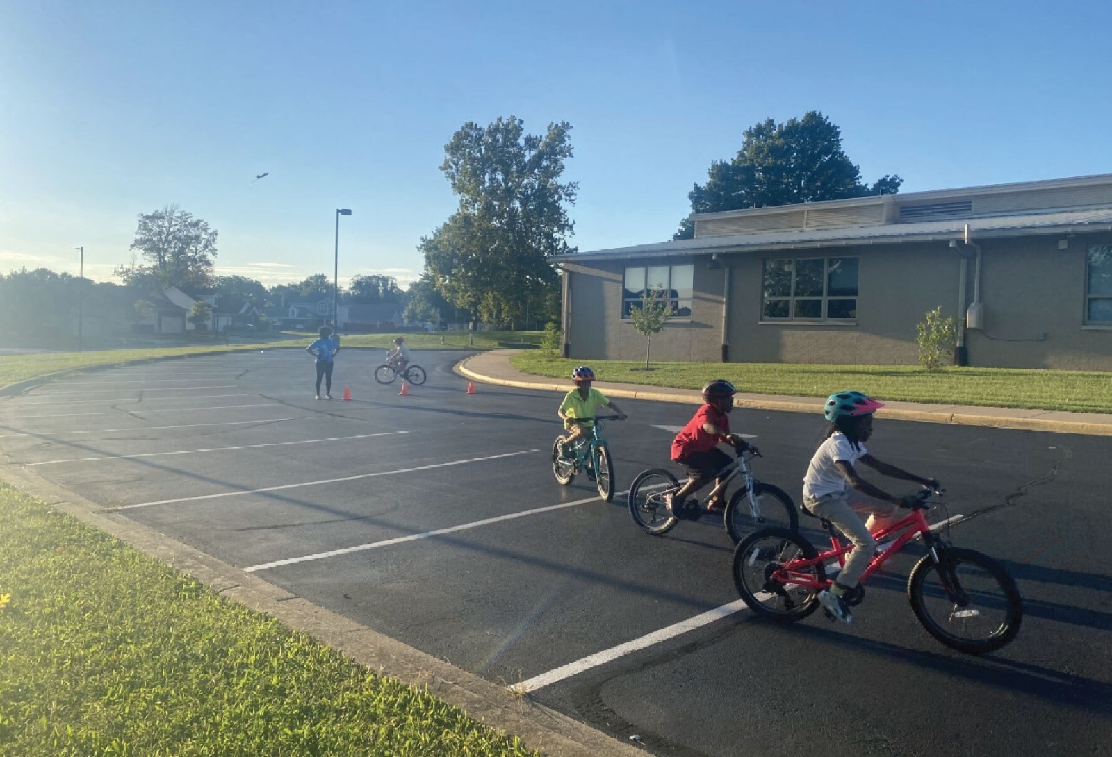 children ride bikes from the city bike library at the William Wells Brown Community Center
