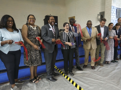 Mayor Gorton, along with others, cuts a ribbon at the Charles Young Center, where Lexington’s new workforce resource center opened its doors in the East End Neighborhood today.