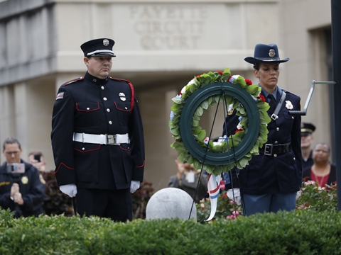 Firefighter Scott Perkins and Detective Kristyn Klingshirn lay a wreath at Phoenix Park to commemorate  the fallen members of the Police and Fire Departments in New York City during the Sept. 11 attacks Sept. 11, 2018.