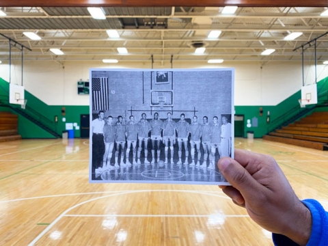 A historic photo from former Dunbar High School held up overlapping the current Dunbar Community Center