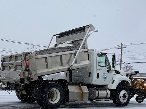 Snow plow treating Lexington streets