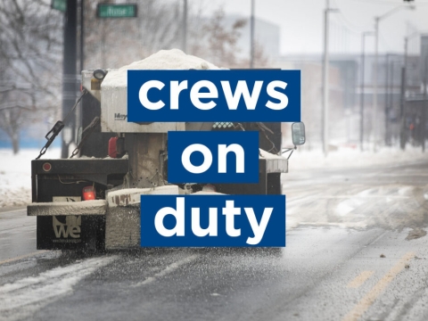 text says "crews on duty" over a photo of a snowplow on a snowy street