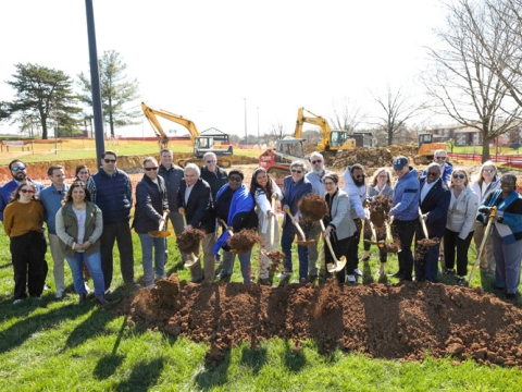A group of people, including Mayor Linda Gorton and Councilmember Fred Brown, with shovels in hand at ceremonial groundbreaking