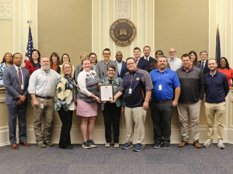 Lexington Parks and Recreation golf staff pose with Mayor Linda Gorton and city councilmembers after recognition for their awards and proclamation for the day being "Play Golf Lex Day"